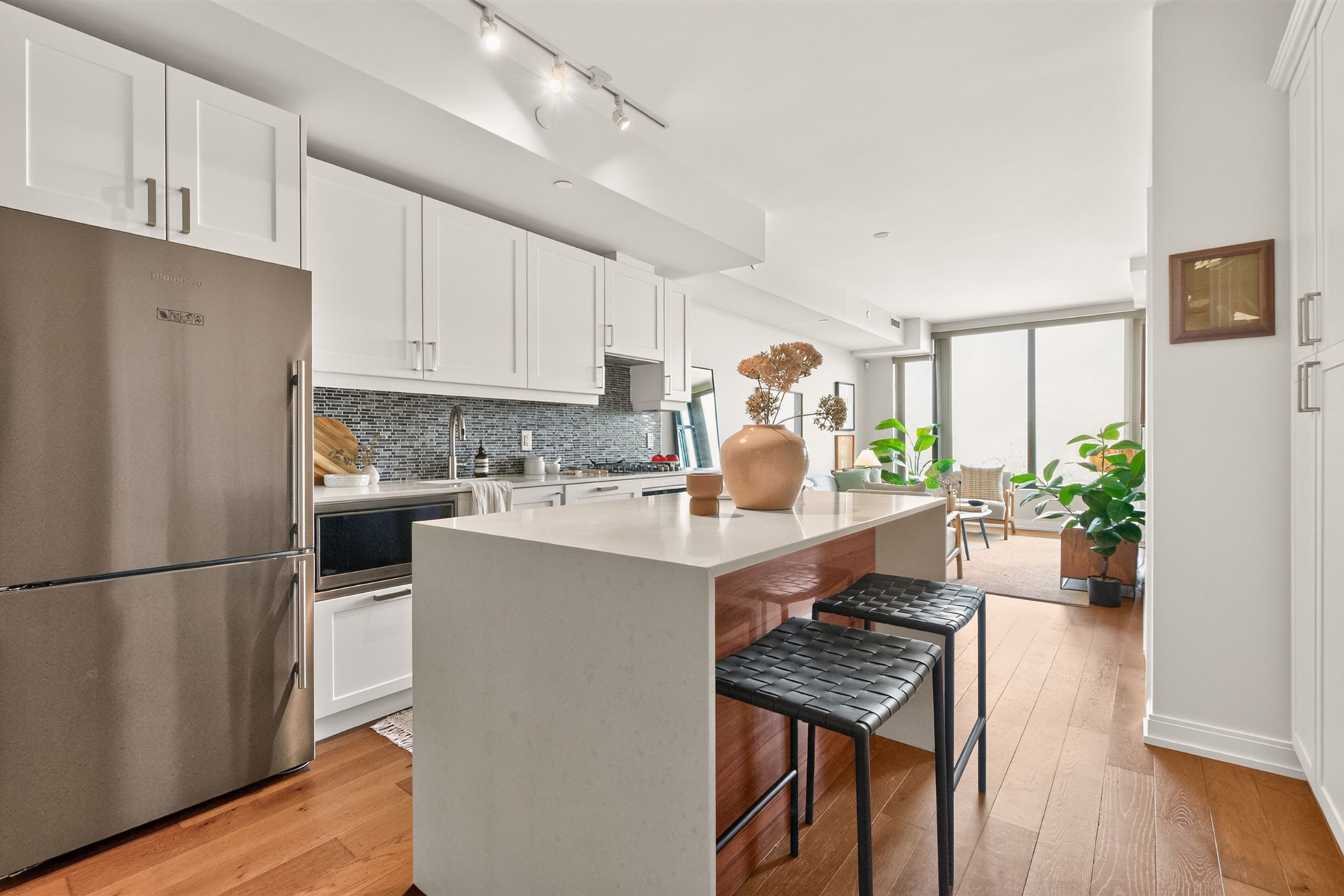Kitchen with waterfall island and Blomberg appliances