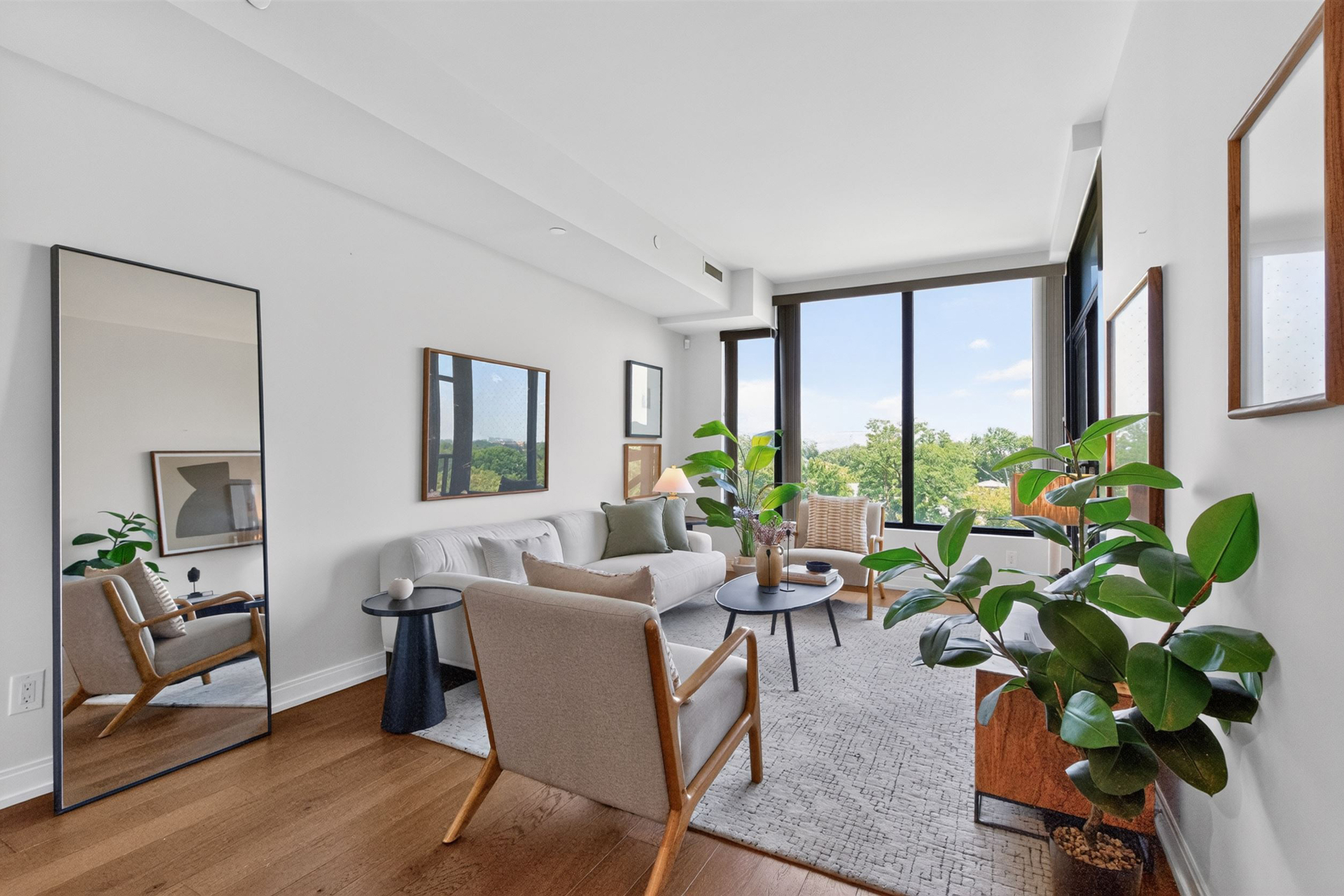 Sun-filled living room with floor-to-ceiling windows