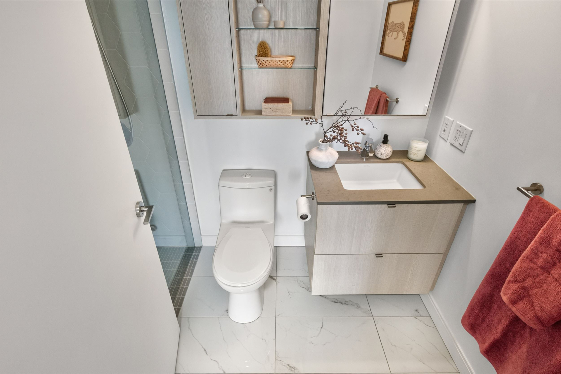 Ensuite bathroom with vanity and built-in shelving
