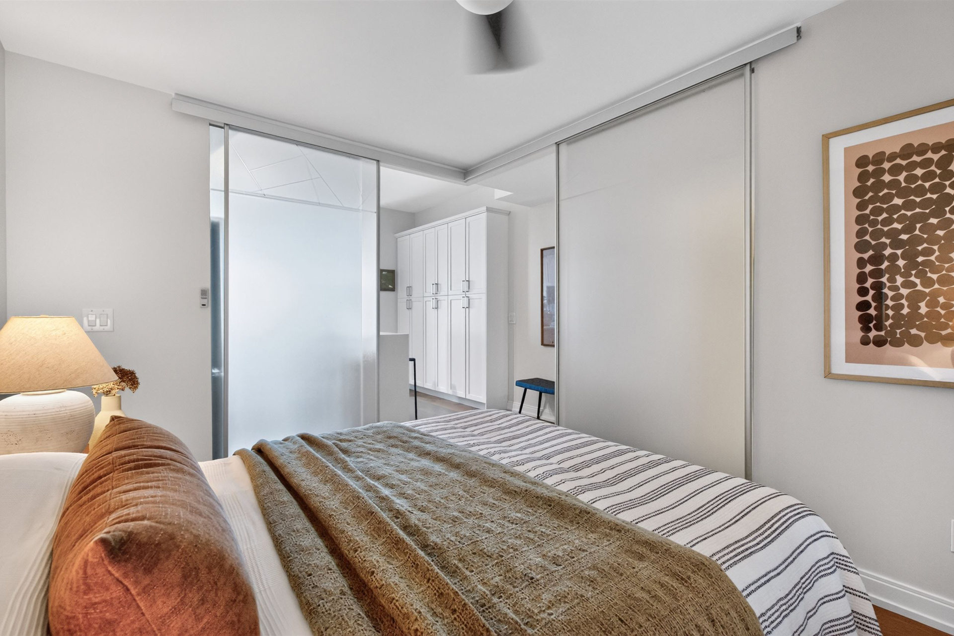 Second bedroom with sliding closet and frosted glass door