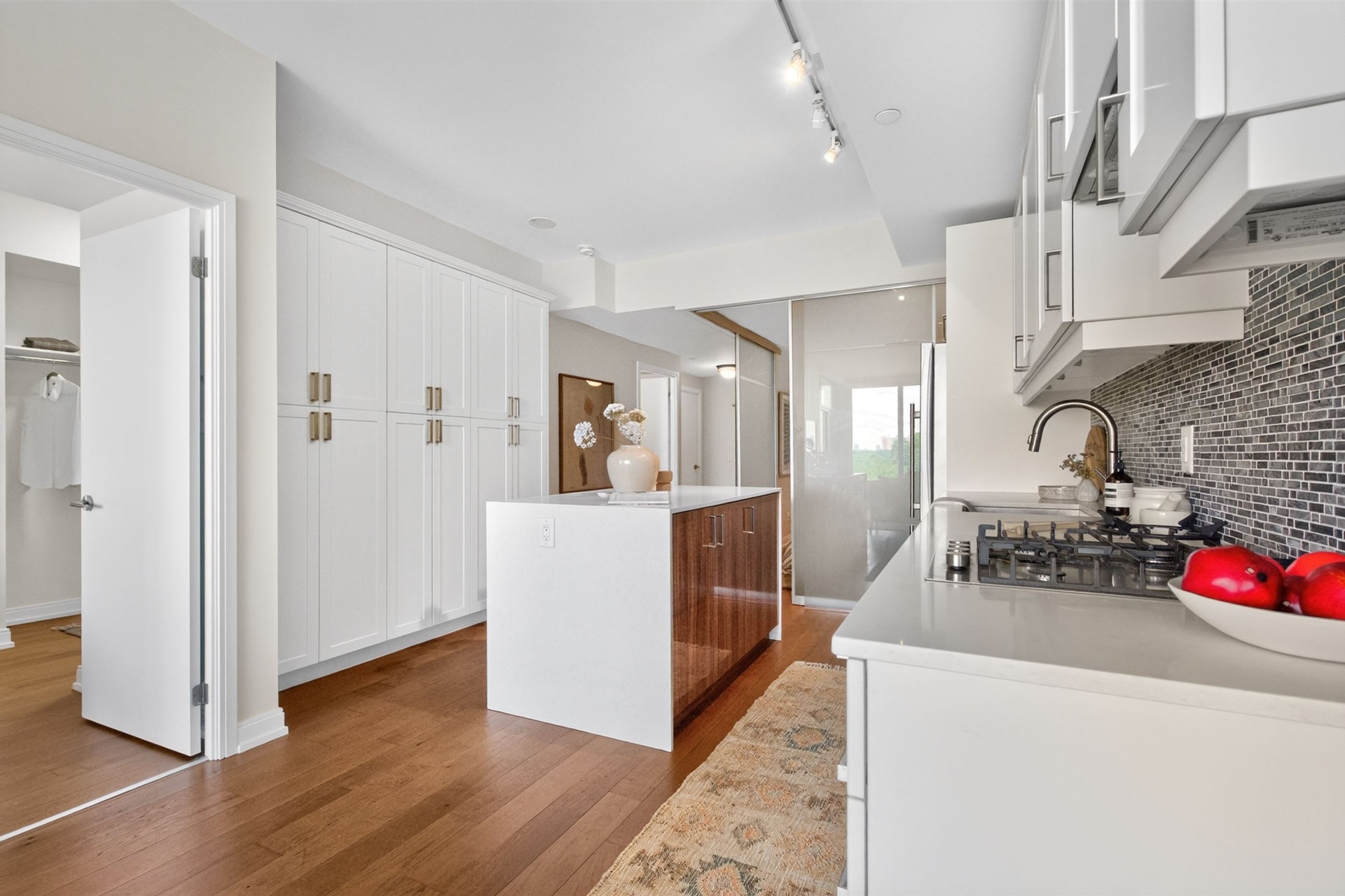 Kitchen with custom storage and walk-in closet