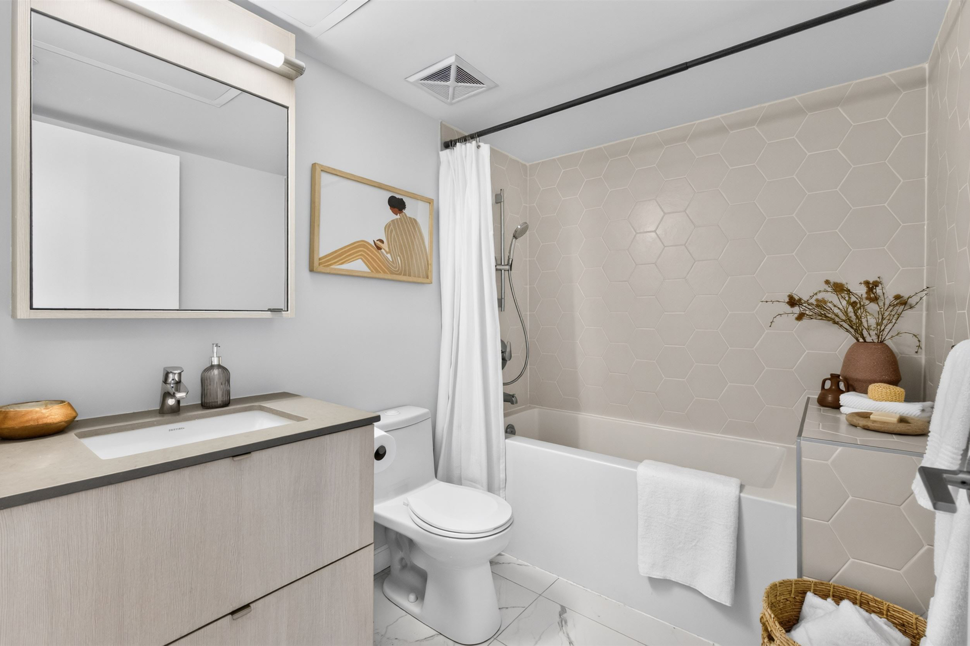 Second bathroom with hex tile surround and quartz vanity